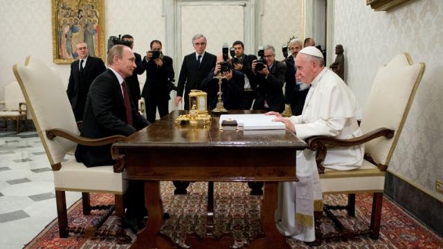 Putin sits with Vatican Leader